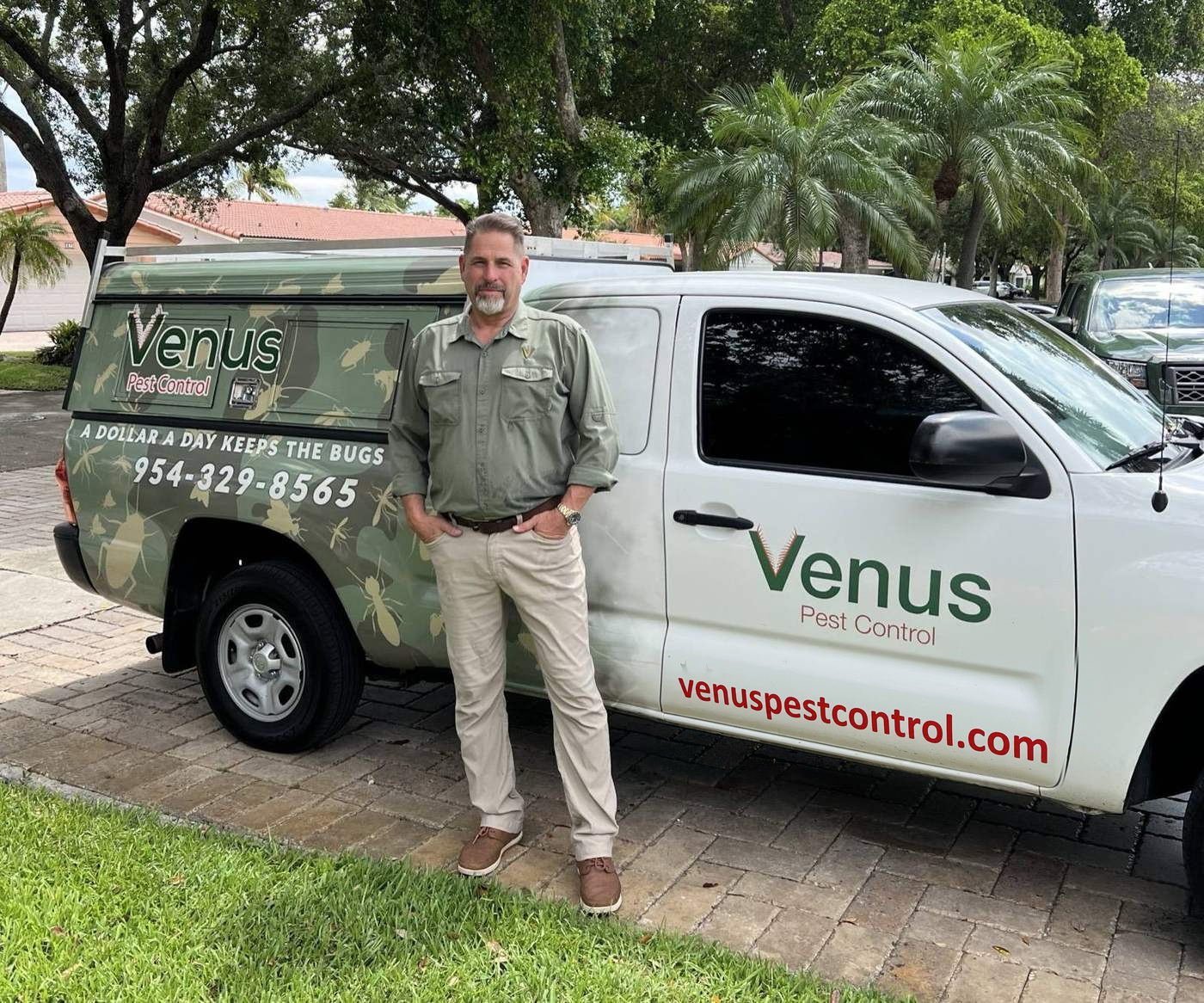 Lawrence Arnold, owner of Venus Pest Control, with his service truck in Miami Lakes, Florida
